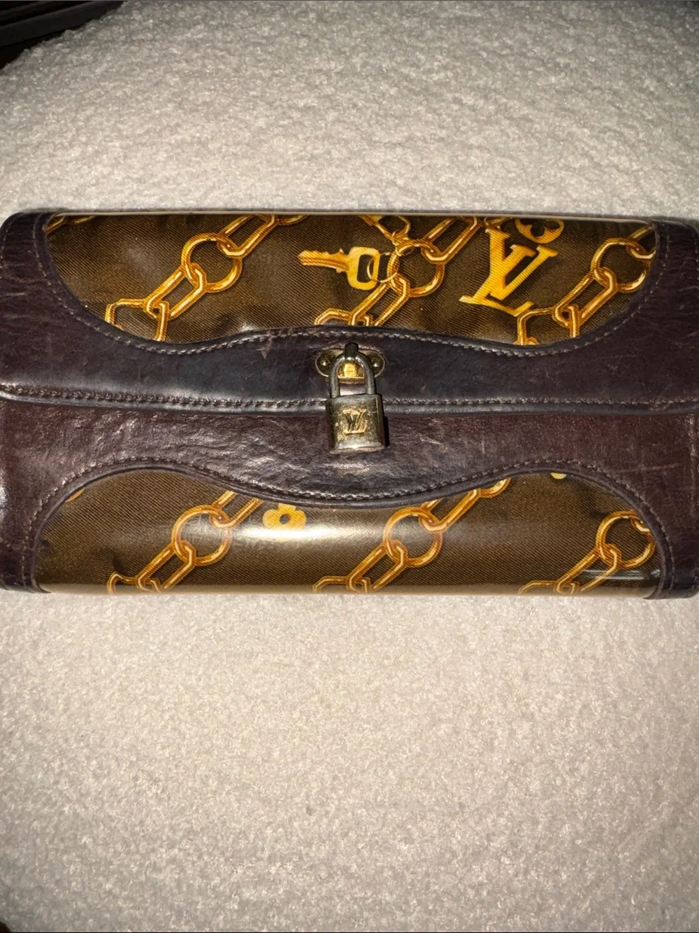 Louis Vuitton Monogram Charms Porte-Monnaie Wallet in brown (7.5 x 4in.)